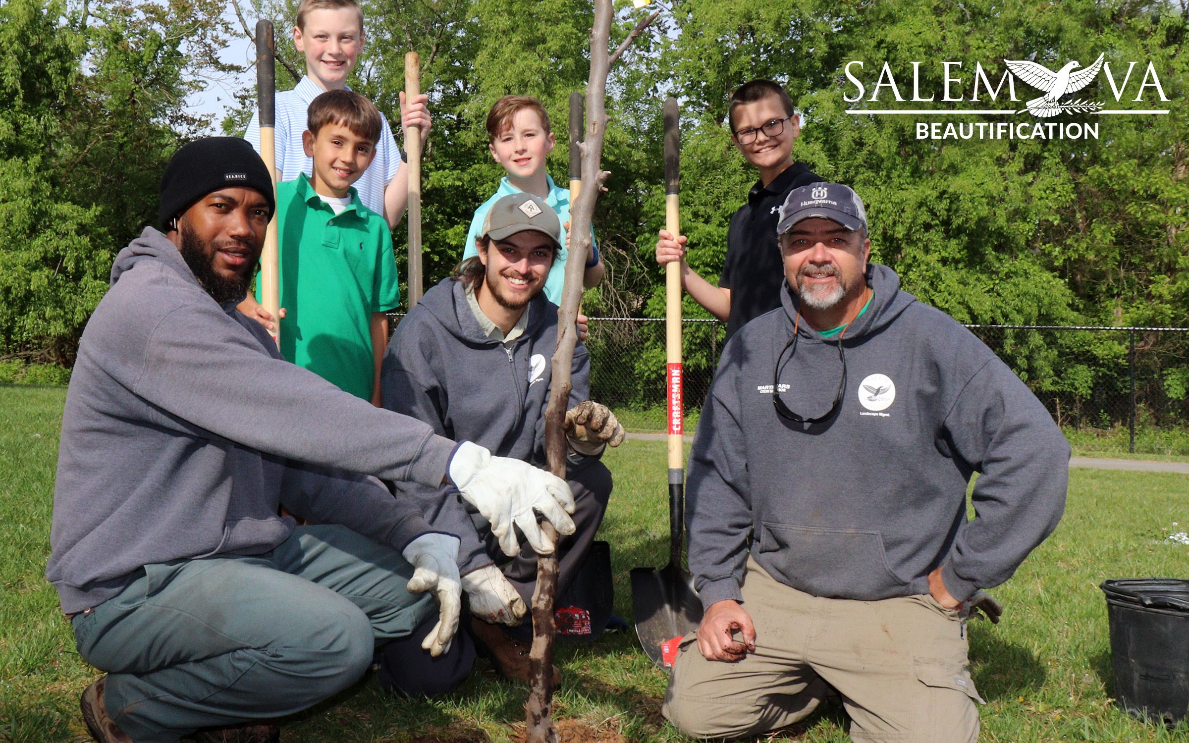 Workers plant trees in the city.